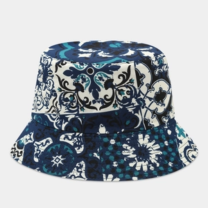 Detailed top view of double-sided bucket hat with vintage blue floral patterns