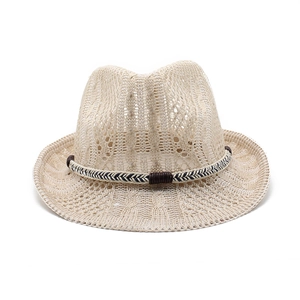Detail of beige hollow woven jazz hat with breathable knit pattern and decorative blue cord