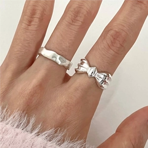 925 sterling silver bow and wavy rings set for women displayed on hand