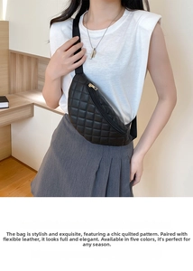 Close-up of quilted black crossbody waist bag with gold zipper detail on model