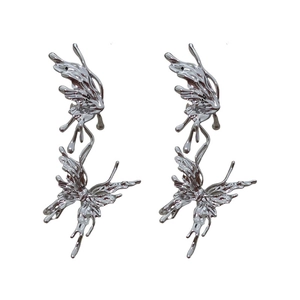 Silver liquid metal butterfly earrings with rhinestone accents in a y2k cyber style