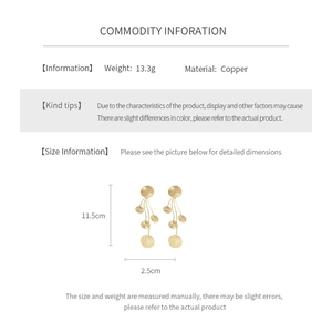 Detailed spec sheet of gold tassel earrings showing 11.5cm length and copper material