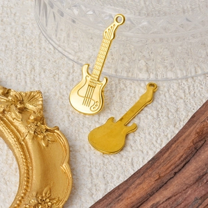 304 stainless steel guitar pendant necklaces showing front and back on a beige surface