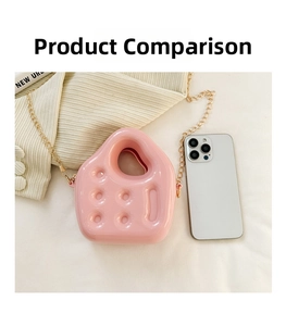 Pink PVC jelly mini bag with gold chain strap shown next to a smartphone for size reference