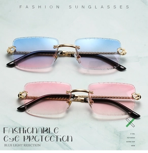 Detail of frameless sunglasses with gold twisted temples and C-shaped hinge ornament