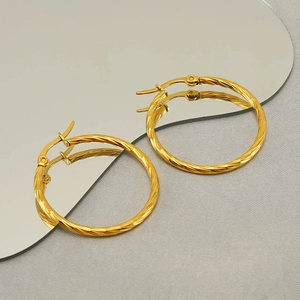 Classic golden twisted rope hoop earrings made of stainless steel with a vintage style