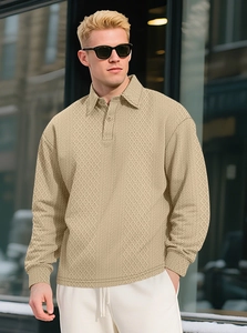 Detailed texture of men's apricot jacquard polo shirt featuring geometric patterns
