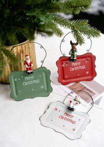 Detailed view of Christmas metal welcome signs featuring Santa, Reindeer, and Snowman figures
