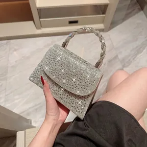 Elegant silver rhinestone evening handbag with metal woven handle and square flap design