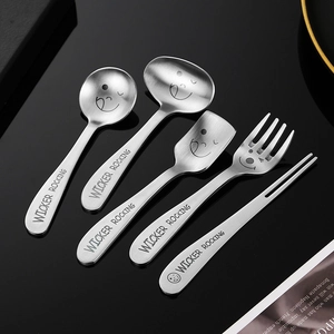 Modern 304 stainless steel dessert spoon and fork set with engraved smiling face and matte finish