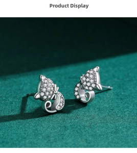 Detail of s925 silver cat stud earrings with sparkling white cubic zirconia stones