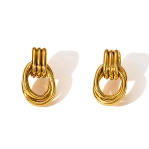 Detail of gold geometric earrings with interlocking triple loops and double rings drops