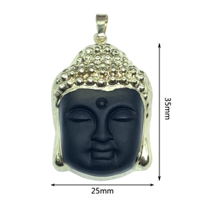 Close-up of a 35mm x 25mm black Buddha head pendant with elegant gold metal edging