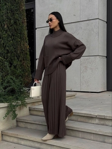 Women's dark brown knit set with oversized turtleneck sweater and wide-leg trousers