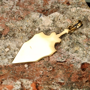 Golden dragon wing sword pendant on rock surface, stylish knight jewelry for men