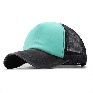 Detail of washed mint green and black mesh trucker hat with breathable rear paneling