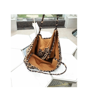 Top-down macro view of the interior structure and leopard print pattern on the canvas tote