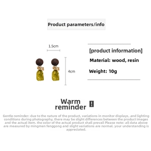 Detail of resin and wood drop earrings featuring dimensions 1.5cm x 4cm and 10g weight