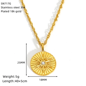 Close-up of 18K gold plated stainless steel sunburst pendant with size and weight details