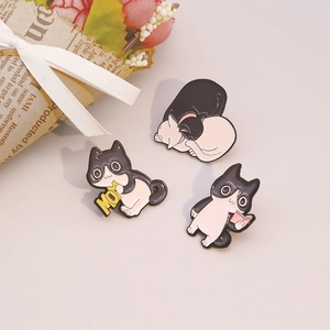 Detailed view of three cute black and white cat enamel pins with MOM heart and book themes