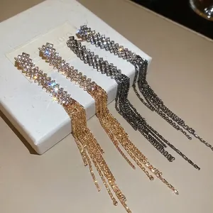 Sparkling tassel drop earrings with rhinestones in gold and gunmetal finishes