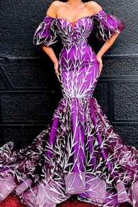 Detail of silver branch embroidery and sequined mesh on a purple mermaid evening gown