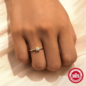 Elegant gold plated S925 sterling silver water drop ring with pavé diamonds on satin background