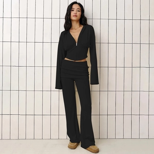 Women's black two-piece sporty set featuring cropped V-neck hoodie and wide-leg trousers