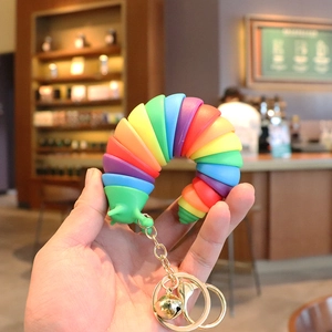 Rainbow slug fidget keychain with golden bell and chain for bags or car keys