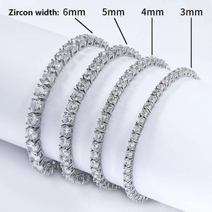 Silver-colored cubic zirconia tennis bracelets in 3mm to 6mm widths on a white stand