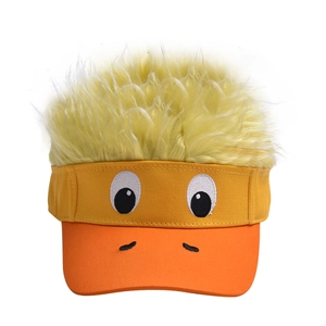 Detail of cartoon duck wig hat featuring plush hair and embroidered eyes with orange bill