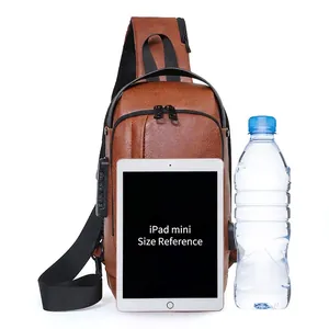 Brown vintage leather chest bag for men with USB port, fitting an iPad mini