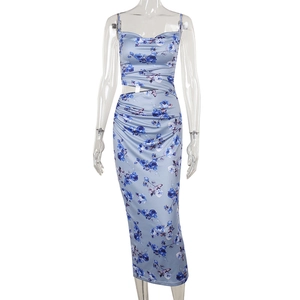 Detail of blue floral maxi dress featuring slim straps and sexy waist hollow out design