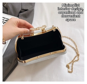 Detail of silver glitter evening bag with gold frame and crystal bow clasp interior view
