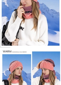 Close-up of pink and purple knitted beanie and scarf set with wavy jacquard texture