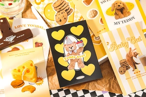 Macro detail of vintage illustration postcards featuring cute teddy bears and kittens