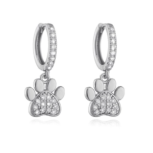 Detailed view of silver hoop earrings featuring sparkling crystal cat paw dangles