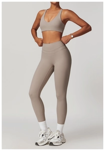 Detailed view of high-waist taupe yoga set featuring sports bra and lifting leggings
