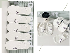 Detailed view of white cotton low cut socks featuring cute embroidered cartoon animals