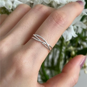 Minimalist 925 sterling silver multilayer crossover ring worn on finger