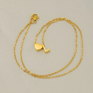 Golden stainless steel necklace featuring a heart charm and a capital letter L pendant