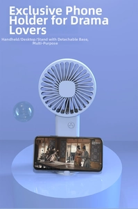 Detail view of portable mini fan with a detachable base acting as a mobile phone holder
