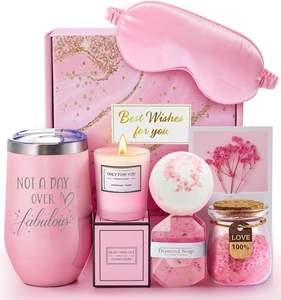 Detailed pink spa gift set with glitter tumbler, scented candle, and velvet eye mask