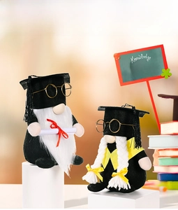 Gnome graduation dolls featuring black caps and glasses on a decorative white display