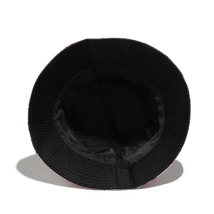 Detail view of the black cotton bucket hat showing reinforced stitching on the inner lining