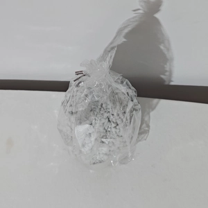 Detail of white artificial snow particles in clear plastic packaging for Christmas decor