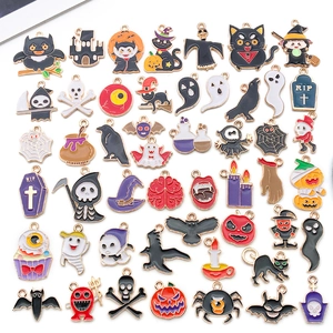 Detailed view of colorful Halloween alloy charms including pumpkins, ghosts and bats