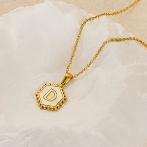 18K gold-plated hexagonal initial D pendant necklace with beads on minimalist stone stand