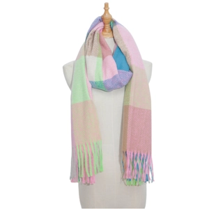 Detail showing soft macaron plaid knit scarf with long decorative fringe on mannequin