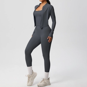 Detailed view of women's dark gray 3-piece yoga set including zip jacket and sports bra